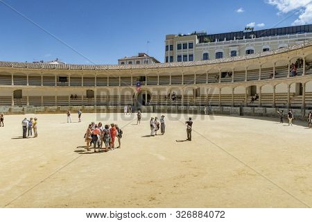 Ronda, Spain - May 17, 2018:  Visitors To The Plaza De Toros Or Bullring. The Bullring At Ronda Is T
