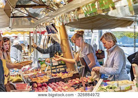 Selestat, France - June 23, 2018: People Buy Fresh Vegetables From The Alsace Region At The Weekly M