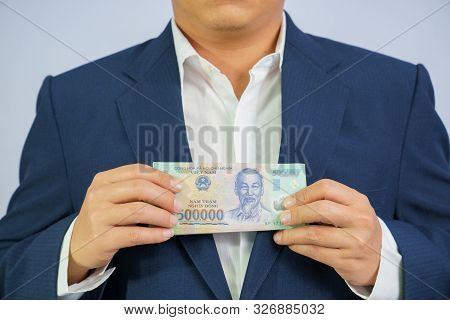 Money In Vietnam Hold On Hand Business Man Wearing A Blue Suit (socialist Republic Of Vietnam), Dong