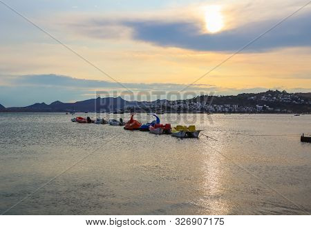 Beautiful Sunset On Aegean Coast With Islands And Mountains, Boats And Catamarans