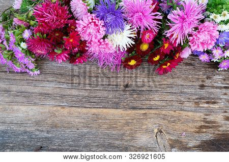 Aster Fresh Flowers, Top View Border On Wooden Background, Naturall Fall Flowers Background