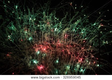 Green And Red Fireworks Celebration Painting The Night Sky