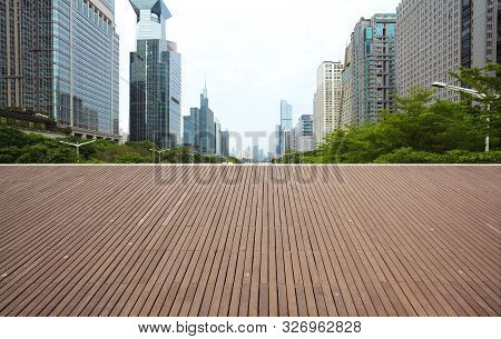 Empty Wood Floor With City Landmark Buildings