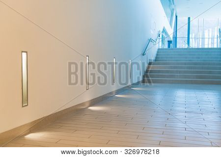 Stone Staircase And Wall Lamps. Decorative Lamps In Modern Spa Center.
