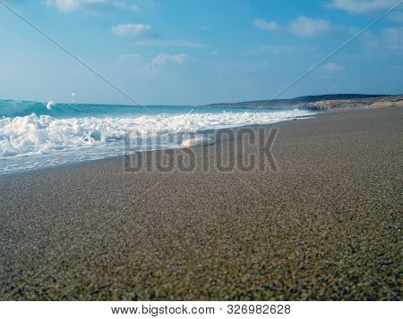 Foam And Waves In The Sea On A Sunny Day. Foam And Waves In The Sea. Powerful Waves Crushing For Bac