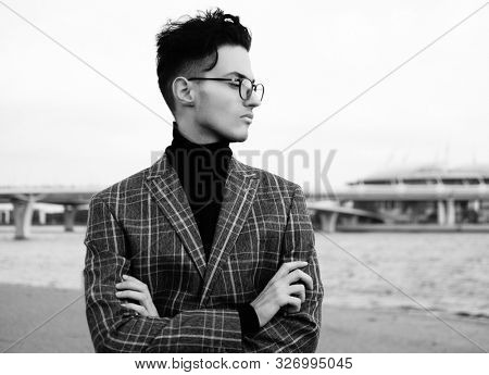 Elegant young handsome man. Symmer day. Black and white picture.