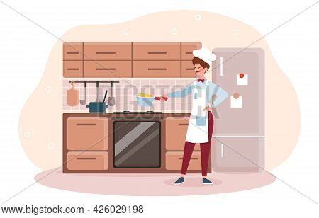 A Man Prepares Food. Cook In An Apron And A Hat Is Standing In The Kitchen And Cooking Spaghetti In 