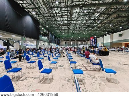 Selangor, Malaysia - July 6,2021 : Public People Can Seen Waiting Patiently In The Hall For Their Tu