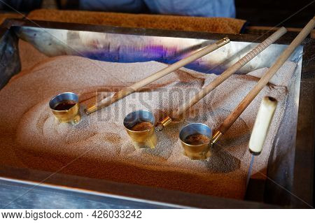 Turkish Coffee In The Turks On The Hot Sand. Shallow Focus.