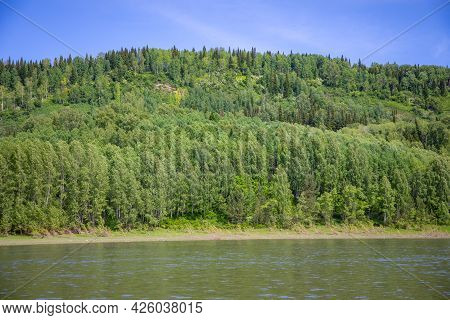 River Tom Flowing Through The Taiga Forests, South Siberia, Russia