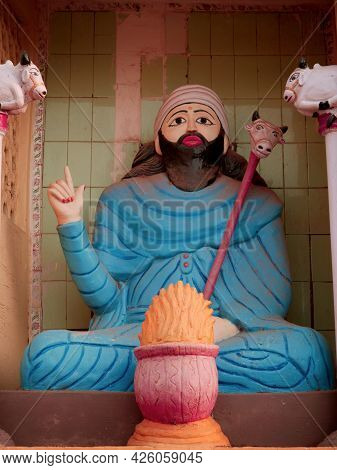 Traditional Beard Man Priest Statue Art Sculpture Presented On Temple.