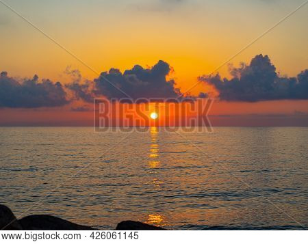 Bright Sunset Over The Sea. Romantic Beachscape
