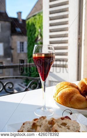 Drinking Of Kir Royal,  French Aperitif Cocktail Made  From Creme De Cassis Topped With Champagne, T