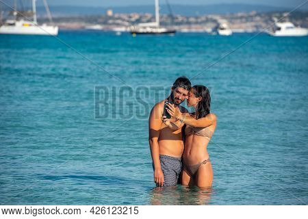Young Man On Levante Beach In Formentera, Spain In Summer 2021.