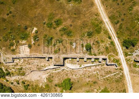 Stone Ruins Of Ancient Town Of Asseria In Dalmatia, Croatia. Aerial View.