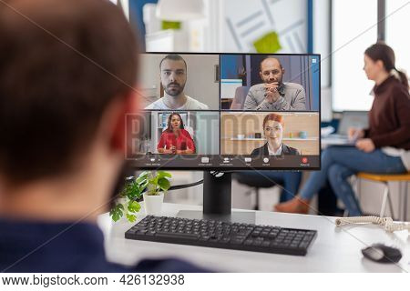 Paralysed Handicapped Businessman Sitting Immobilized In Wheelchair Having Videomeeting Discussing O