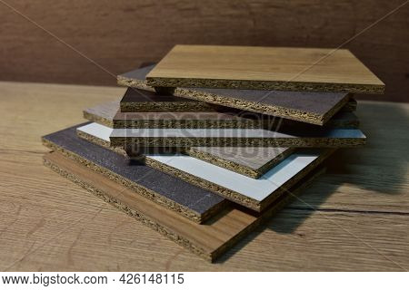 Samples Of Fibreboard Panels With Wood Texture. Laminated Cpd. Chipboard Pvc Edge. Wooden Furniture 