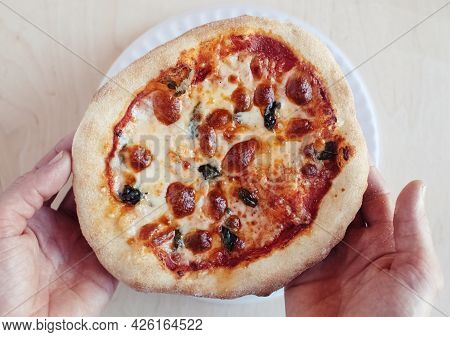 A Close-up Of A Mini Pizza In A Disposable Dish. Top View Of Takeaway Food In Fast Food Cafe. The Ph