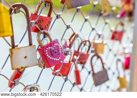 Salzburg, Austria - 9 April 2015 - Love Padlocks Hang On Chainlink Fence Of A Bridge In Salzburg, Au
