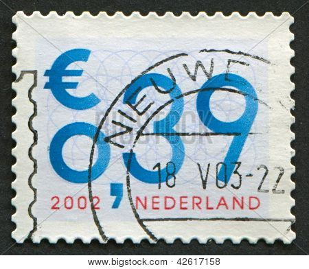 Países Baixos - CIRCA 2002: Um selo imprimido na Holanda mostra imagem do número 0,39, por volta de 2002.