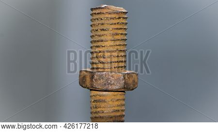 Old Rusty Bolt, Iron Rod With Screw Threads. Rusted Mechanical Components. Threaded Bolt And Nut Iso
