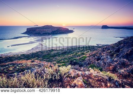 Island Gramvousa and the beautiful Balos beach on sunset in Crete island, Greece. Horizontal camera pan