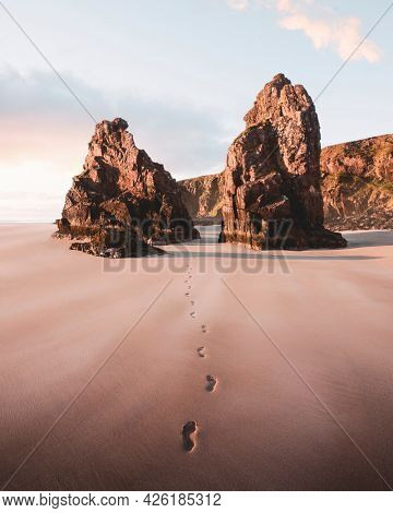Footsteps on the sand passing through the outer Hebrides island, Scotland