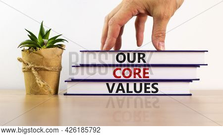 Our Core Values Symbol. Books With Words 'our Core Values'. Beautiful Wooden Table, White Background