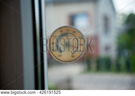 A Plastic Transparent Square Thermometer Shows A High Temperature Of 36 Degrees Celsius