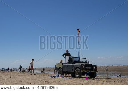 Old Hunstanton, Norfolk, England - June 13 2021. Black  On All-terrain Vehicle Old Hunstanton Sandy 