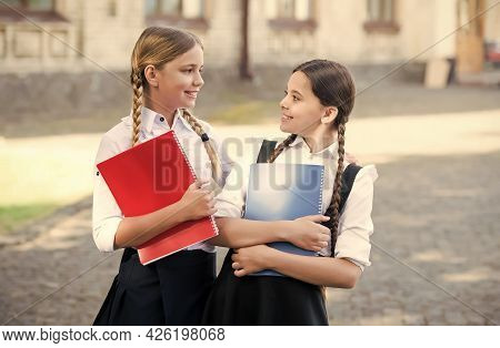 Primary And Secondary Schooling. Happy Children Hold Books Outdoors. Formal Schooling. School Educat