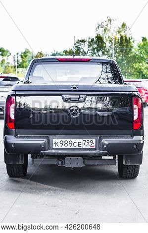 Moscow, Russia - June 2021: Black Mercedes-benz X-class Suv Pickup Truck On The City Road. Rear View