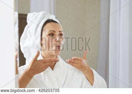 Young Woman Doing Facial Gymnastics Self Massage And Rejuvenating Exercises. Face Building For Skin 
