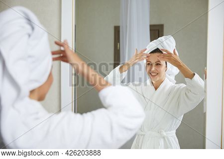 Young Girl Doing Facial Gymnastics Self Massage And Rejuvenating Exercises In The Morning After Taki