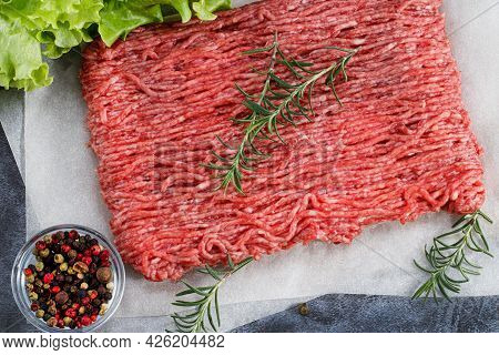 Raw Minced Meat And Spices Top View. Minced Meat Close Up.