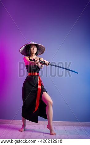 Slender Asian Woman An Asian Hat With A Katana In Her Hand Image Of A Samurai