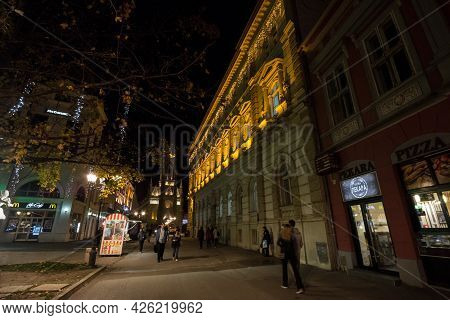 Novi Sad, Serbia - November 18, 2019: Selective Blur On People Walking With Speed Blur By The Name O