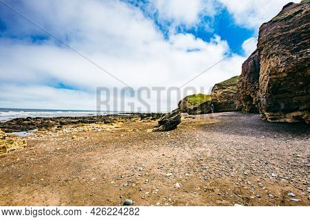 Sunny Cliffs and beach at Blackhall Rocks and Cromdon Dene Beach