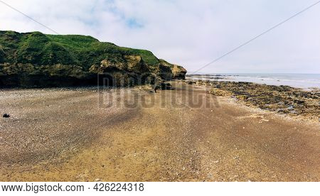 Sunny Cliffs and beach at Blackhall Rocks and Cromdon Dene Beach