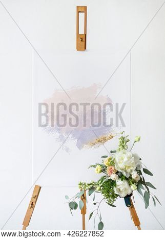 A craft painting on a canvas standing on a easel mockup