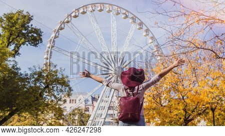 A Happy Young Woman Stop Near The Budapest Eye Big Ferris Wheel In Budapest, Hungary