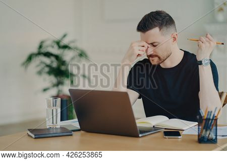 Stressed Thoughtful Male Freelancer Or Businessman In Casual Wear Feeling Tired And Having Problems 