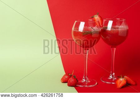 Alcoholic Cocktail Rossini And Ingredients On Two Tone Background