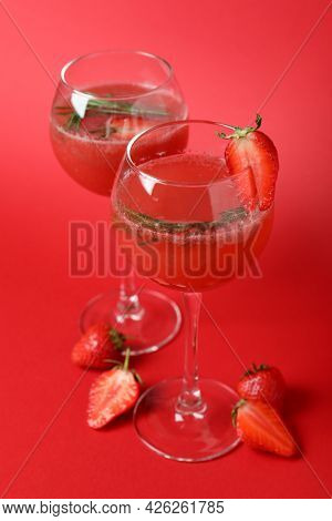 Alcoholic Cocktail Rossini And Ingredients On Red Background