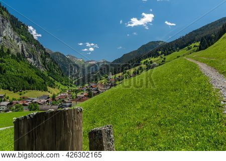 Summer Valley With Grossarler Ache Small River And Blue Cloudy Sky