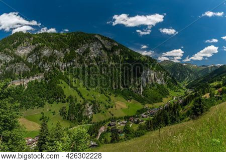 Summer Valley With Grossarler Ache Small River And Blue Cloudy Sky