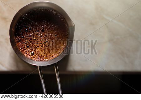Ready-made Turkish Coffee In A Cezva In A Turk On The Table Top View