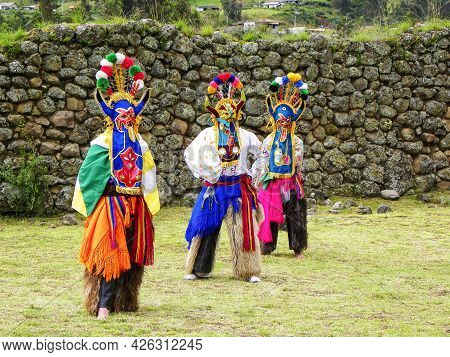 Chobshi, Azuay, Ecuador - June 20,2021: Group Of Dancers As Folk Characters Devil Huma Performs Outd