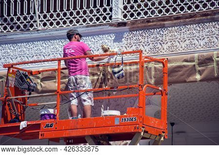 Torrevieja, Spain, 12.05.2021, Builder Doing Reconstraction Of Building, Painting Work