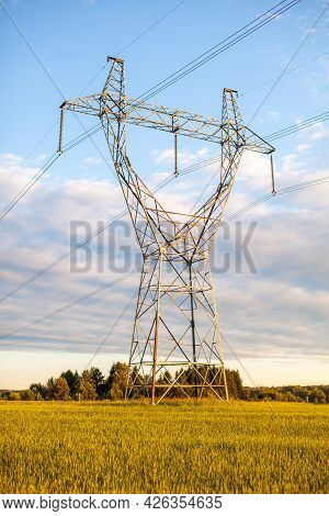 Metal Poles Electric Supports For High-voltage Wires In The Fields In The Summer.high Voltage Poles 